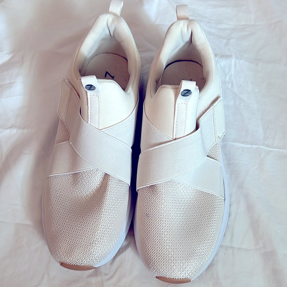 Cream Slide On Sneakers with Criss Cross Strap Detail.